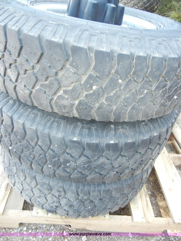 image for item C4179 (5) used 16" tires with rims and caps