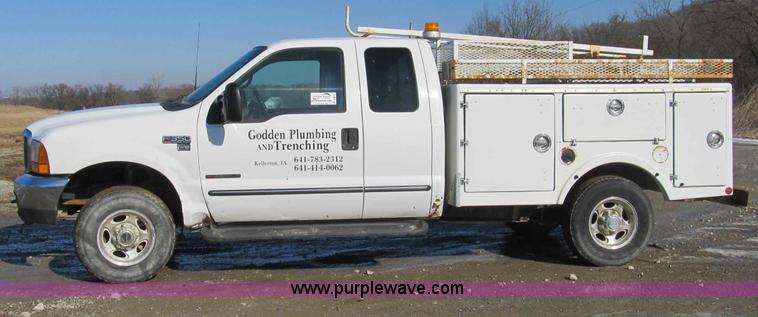 image for item A8074 2000 Ford F350 Lariat Super Duty SuperCab truck with utility bed