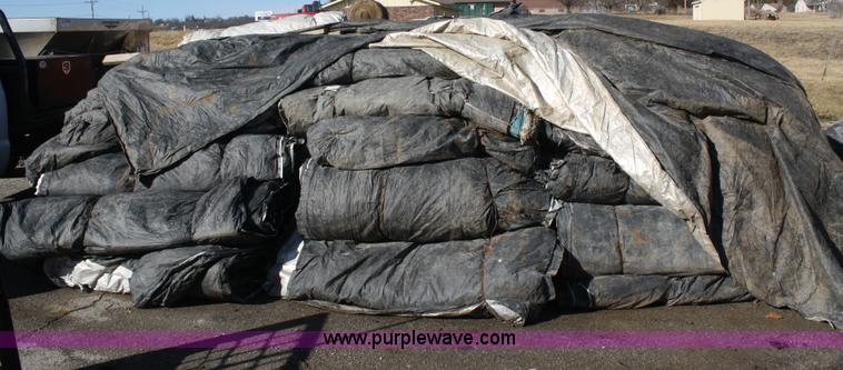 image for item A6943 Approximately 90 12' x 25' concrete double tarps