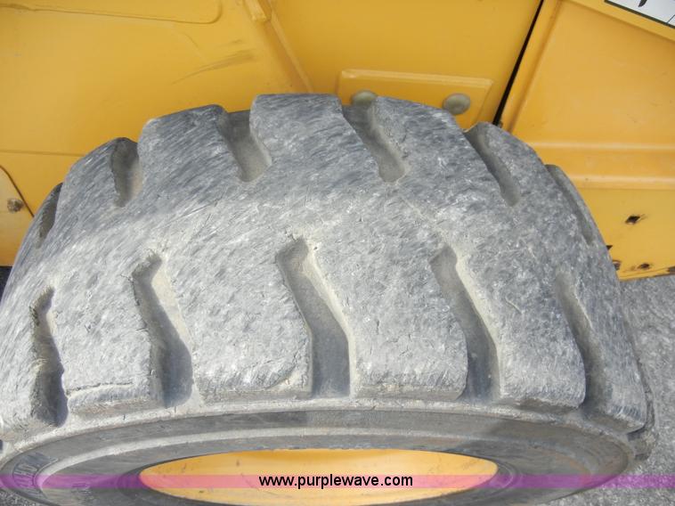 image for item C4103 1999 John Deere 250 skid steer