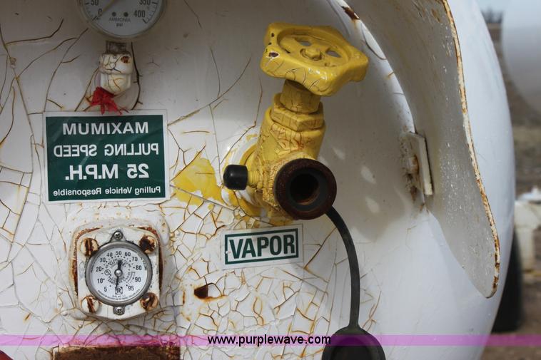 image for item A7368 1000 gallon anhydrous ammonia tank with running gear