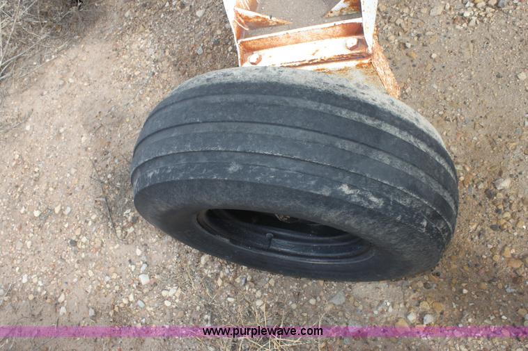 image for item A7368 1000 gallon anhydrous ammonia tank with running gear