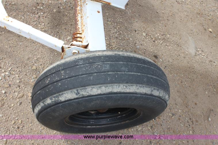 image for item A7368 1000 gallon anhydrous ammonia tank with running gear