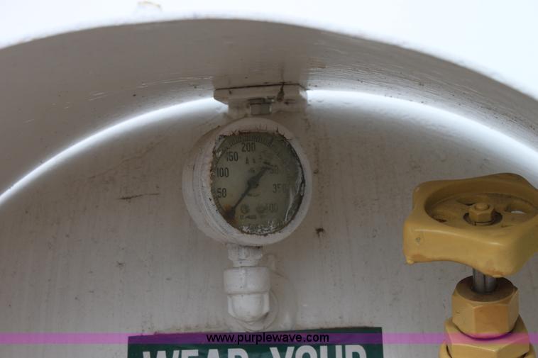 image for item A7369 1000 gallon anhydrous ammonia tank with running gear