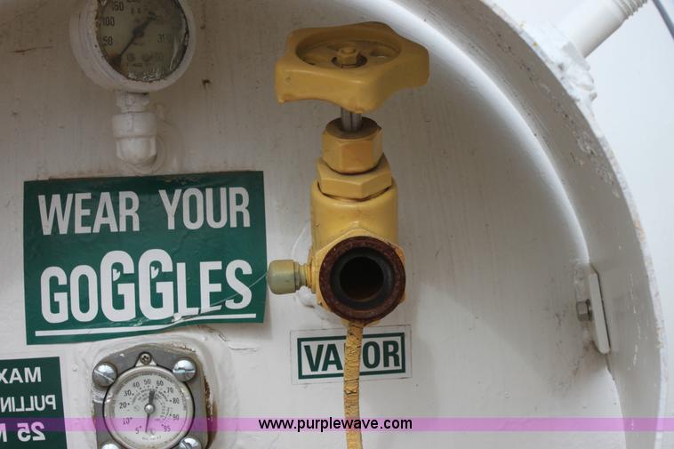 image for item A7369 1000 gallon anhydrous ammonia tank with running gear
