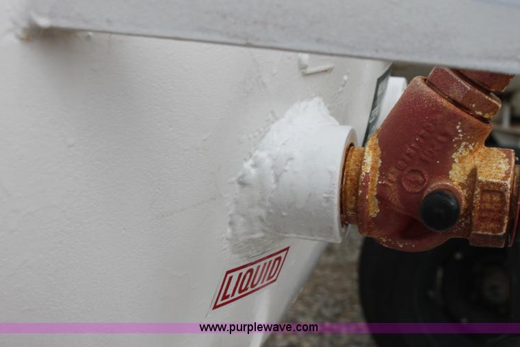 image for item A7370 1000 gallon anhydrous ammonia tank with running gear