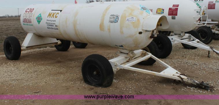 image for item A7371 1000 gallon anhydrous ammonia tank with running gear