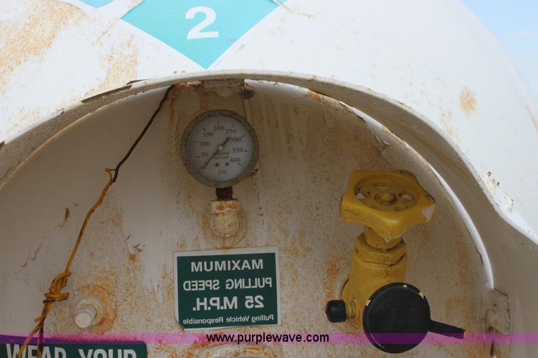 image for item A7371 1000 gallon anhydrous ammonia tank with running gear