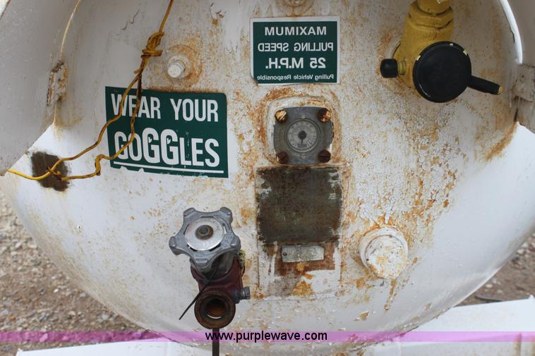 image for item A7371 1000 gallon anhydrous ammonia tank with running gear