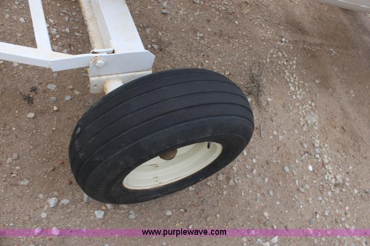 image for item A7371 1000 gallon anhydrous ammonia tank with running gear