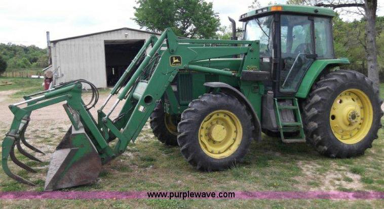 image for item B1103 1995 John Deere 7200 MFWD tractor with loader