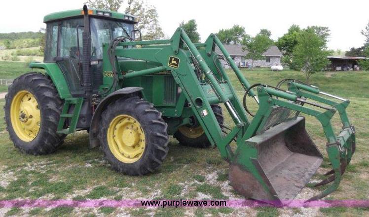 image for item B1103 1995 John Deere 7200 MFWD tractor with loader