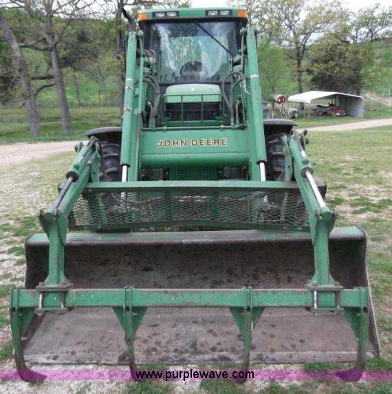 image for item B1103 1995 John Deere 7200 MFWD tractor with loader