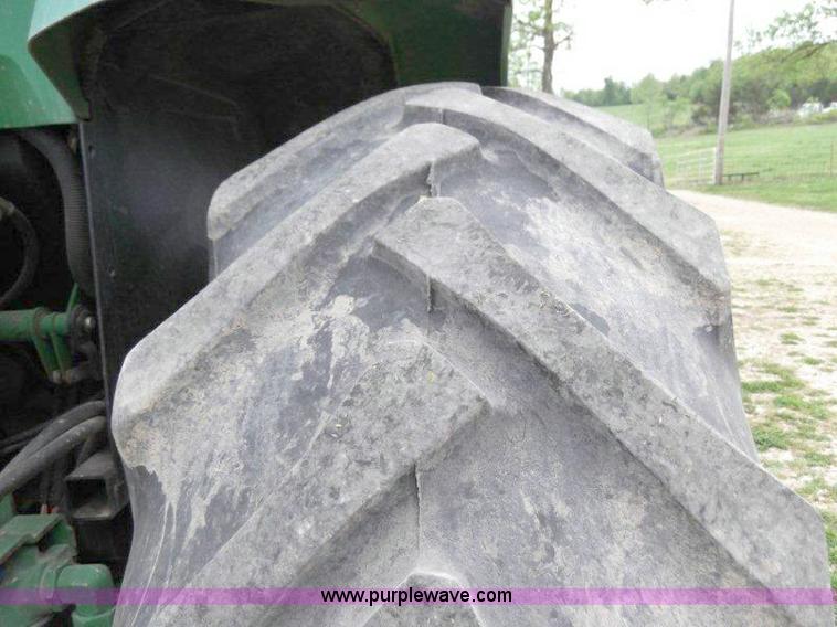 image for item B1103 1995 John Deere 7200 MFWD tractor with loader