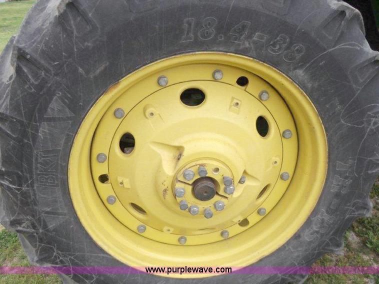 image for item B1103 1995 John Deere 7200 MFWD tractor with loader