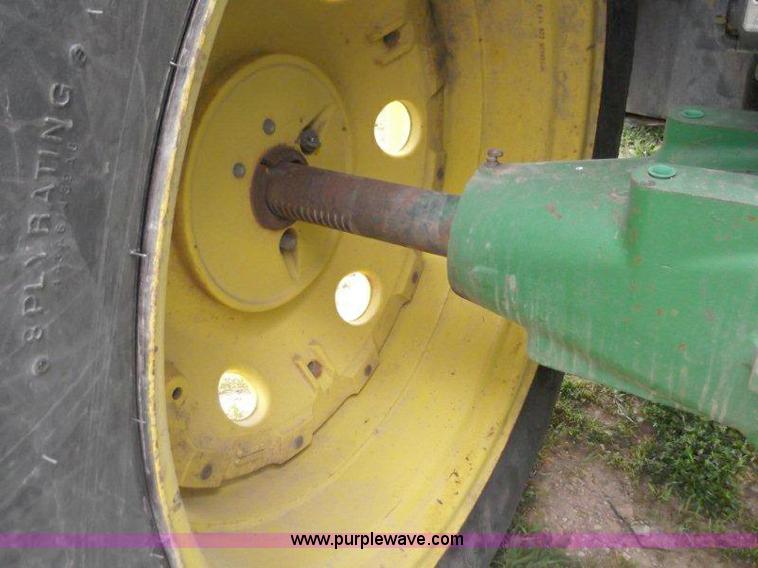 image for item B1103 1995 John Deere 7200 MFWD tractor with loader