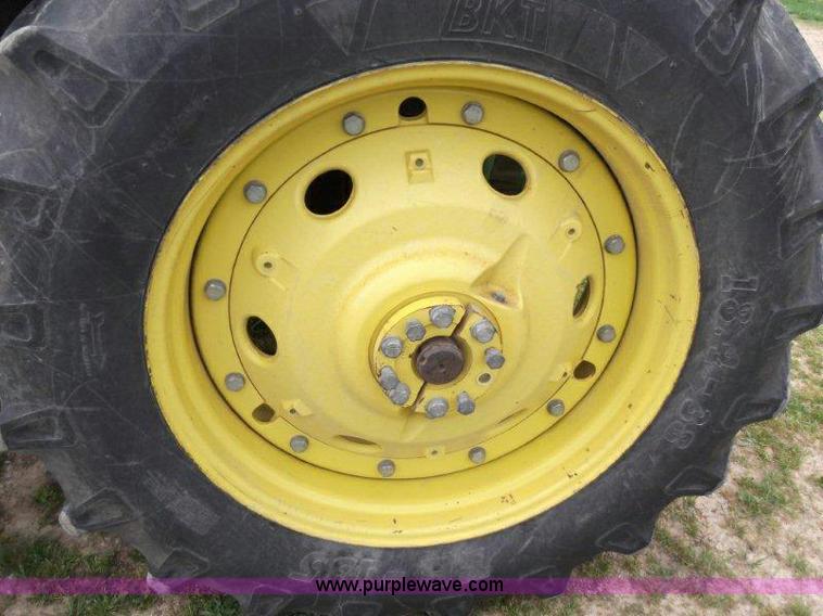 image for item B1103 1995 John Deere 7200 MFWD tractor with loader