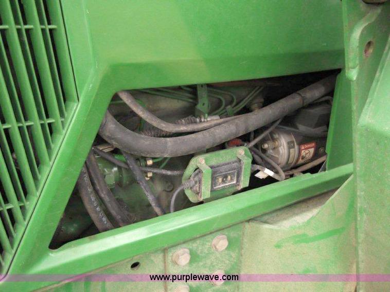 image for item B1103 1995 John Deere 7200 MFWD tractor with loader