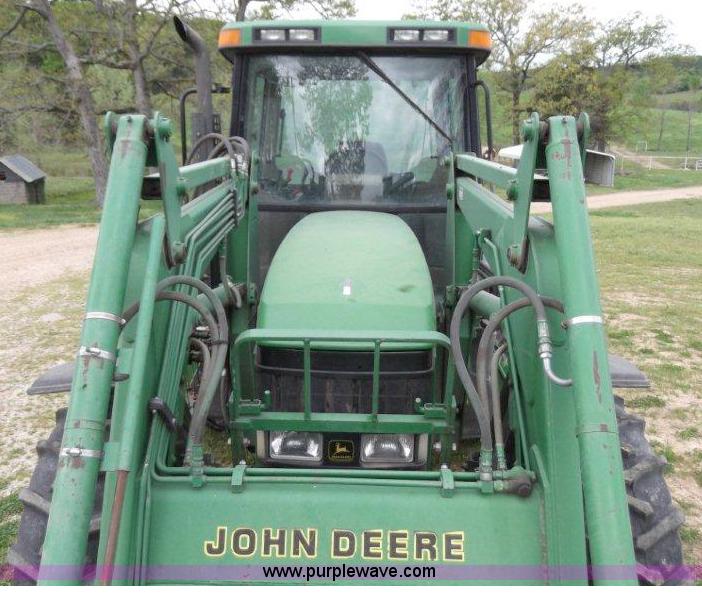 image for item B1103 1995 John Deere 7200 MFWD tractor with loader
