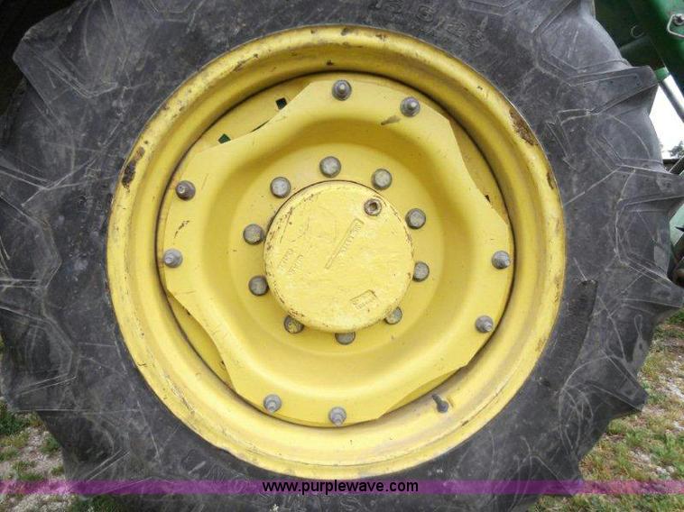 image for item B1103 1995 John Deere 7200 MFWD tractor with loader