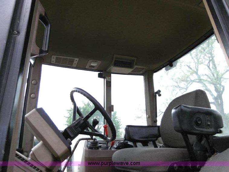 image for item B1103 1995 John Deere 7200 MFWD tractor with loader