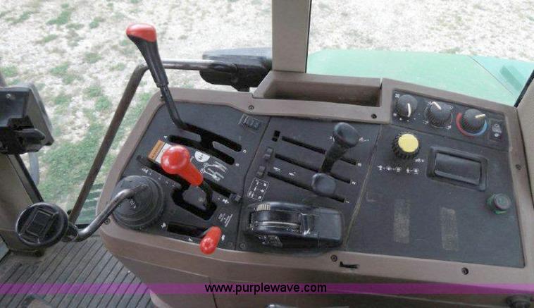 image for item B1103 1995 John Deere 7200 MFWD tractor with loader