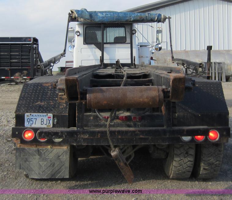 image for item C5366 1988 Mack DM686S roll off truck