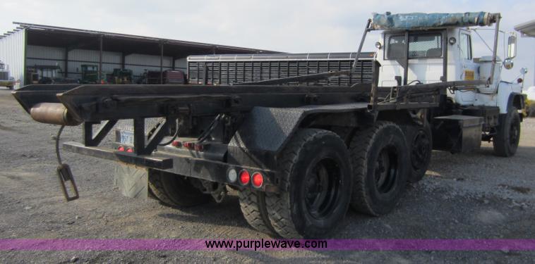 image for item C5366 1988 Mack DM686S roll off truck