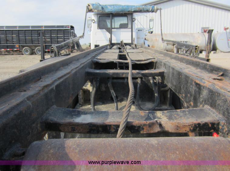 image for item C5366 1988 Mack DM686S roll off truck