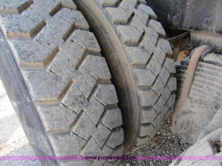 image for item C5366 1988 Mack DM686S roll off truck