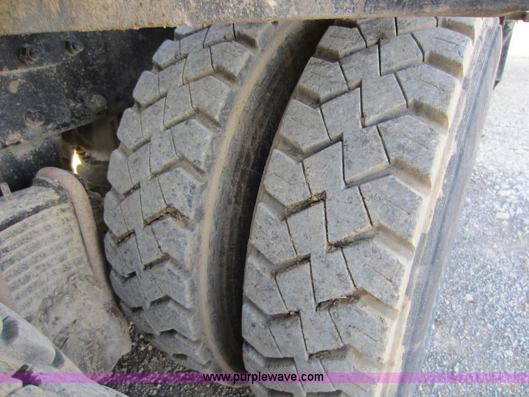 image for item C5366 1988 Mack DM686S roll off truck