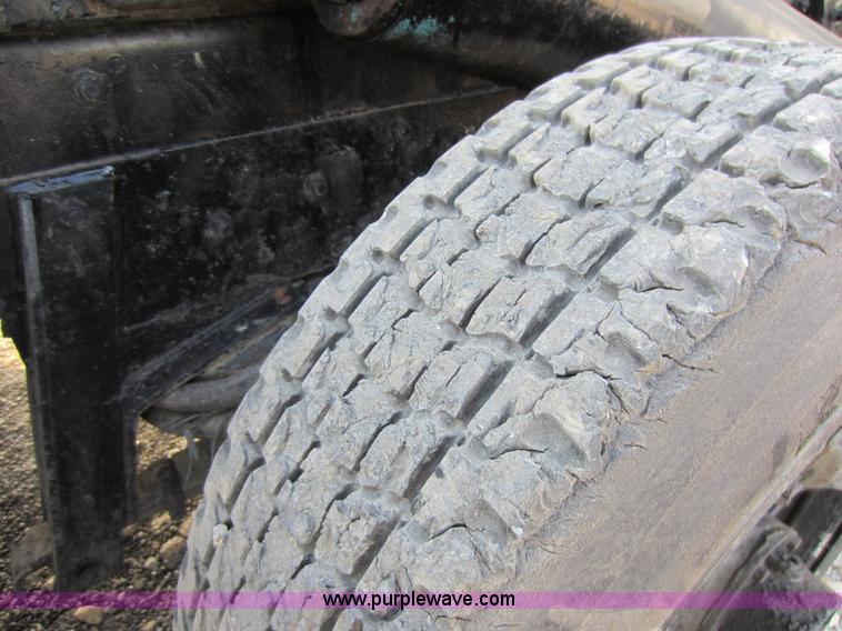 image for item C5366 1988 Mack DM686S roll off truck