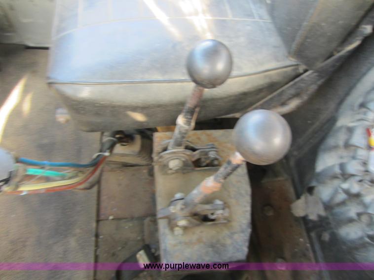 image for item C5366 1988 Mack DM686S roll off truck