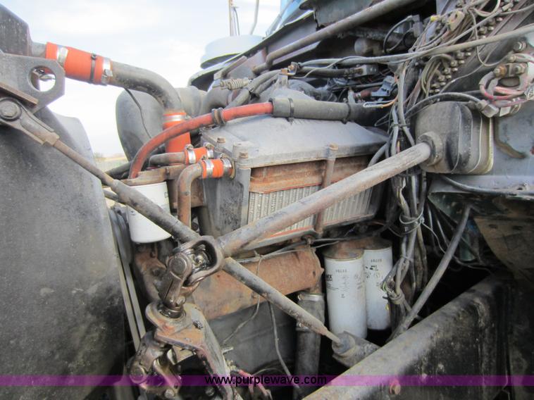 image for item C5366 1988 Mack DM686S roll off truck