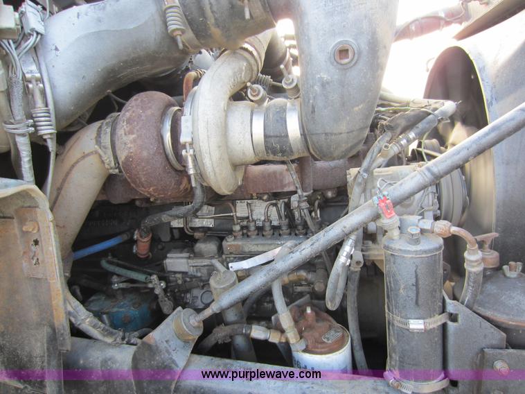 image for item C5366 1988 Mack DM686S roll off truck