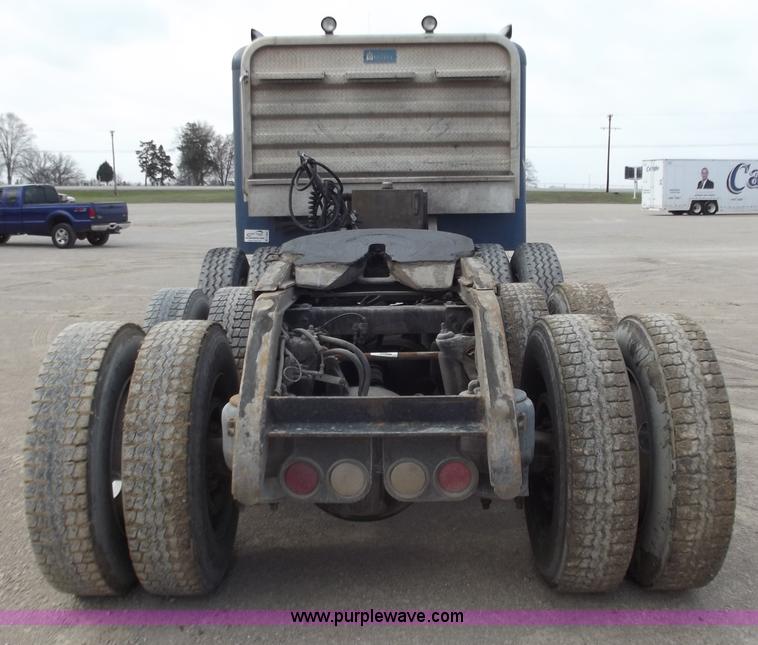 image for item D3693 1989 Peterbilt 379 triple axle semi truck