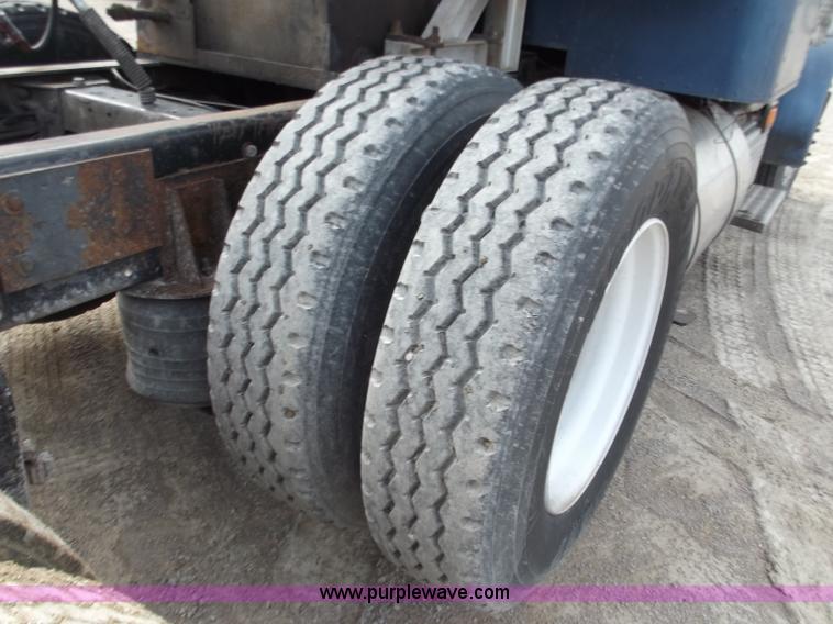 image for item D3693 1989 Peterbilt 379 triple axle semi truck