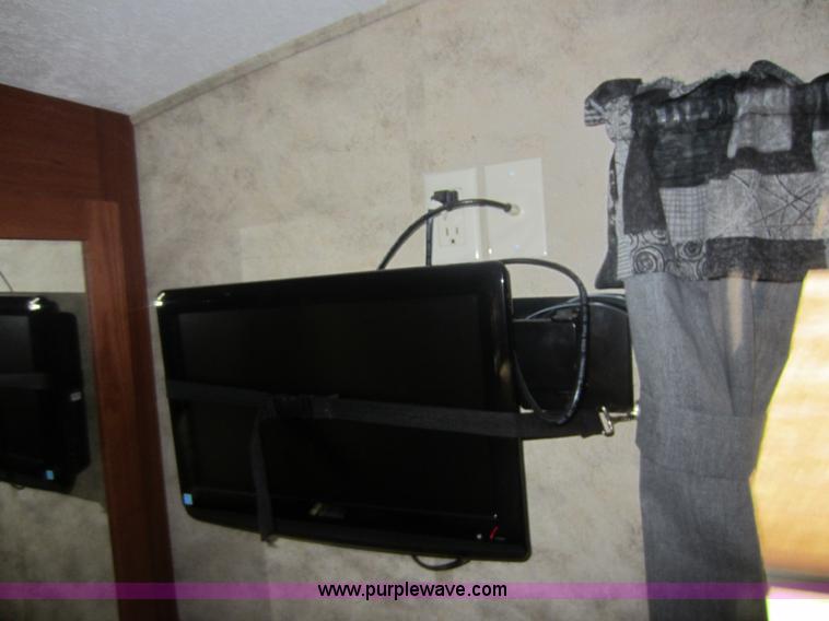 image for item C5426 2011 Keystone Fuzion toy hauler travel trailer