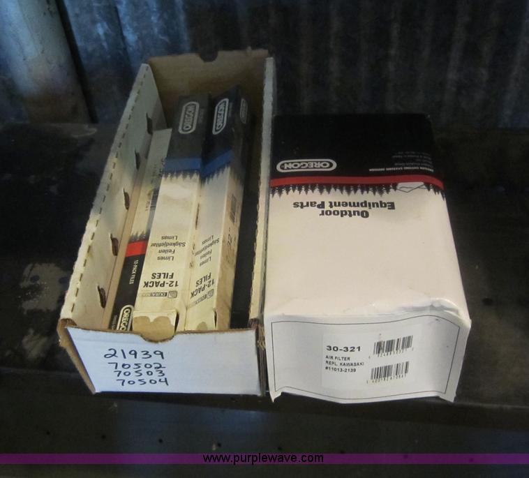 image for item V9033 Assorted air filters, Oregon chainsaw bars, mower blades, and other parts