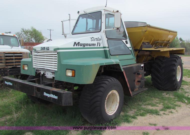 image for item B7211 Loral Magnum III center cab spreader truck