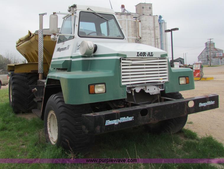 image for item B7211 Loral Magnum III center cab spreader truck