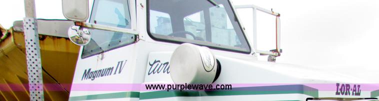 image for item B7211 Loral Magnum III center cab spreader truck