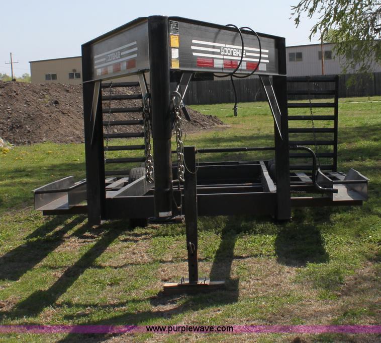 image for item D7574 2003 Donahue EXG160 tandem axle swather trailer