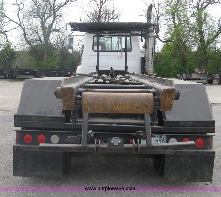 image for item A6153 1989 Mack R688ST tandem axle roll off truck