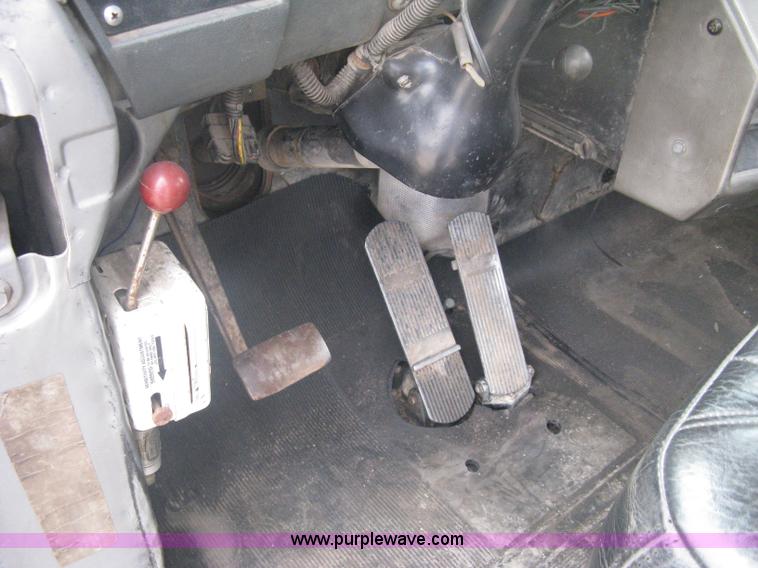 image for item A6153 1989 Mack R688ST tandem axle roll off truck