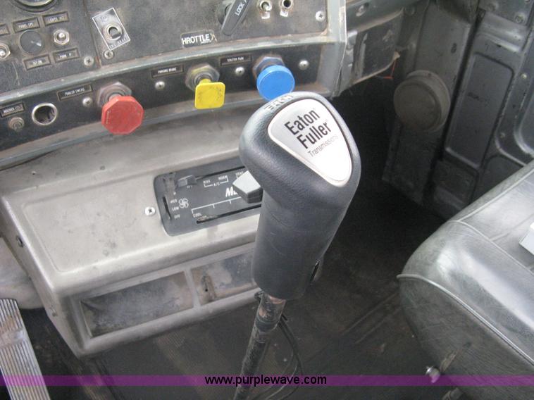 image for item A6153 1989 Mack R688ST tandem axle roll off truck