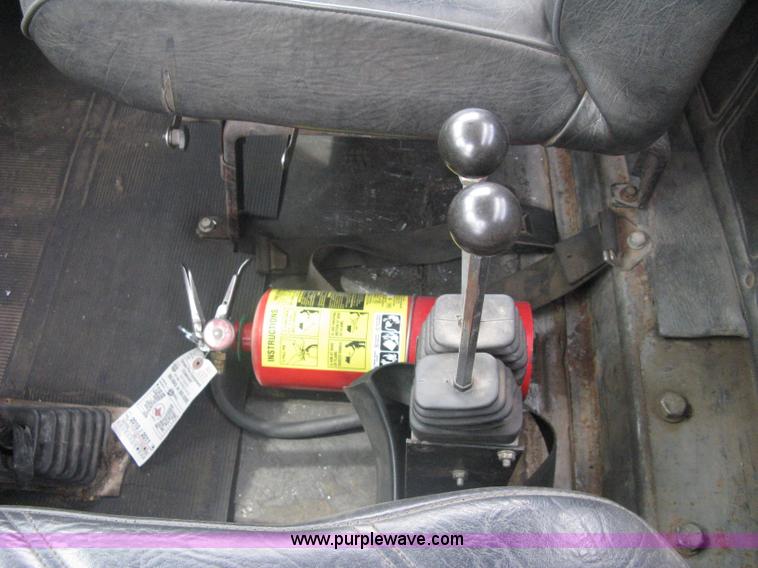 image for item A6153 1989 Mack R688ST tandem axle roll off truck