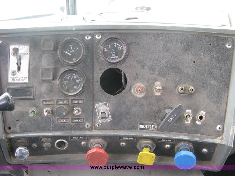 image for item A6153 1989 Mack R688ST tandem axle roll off truck