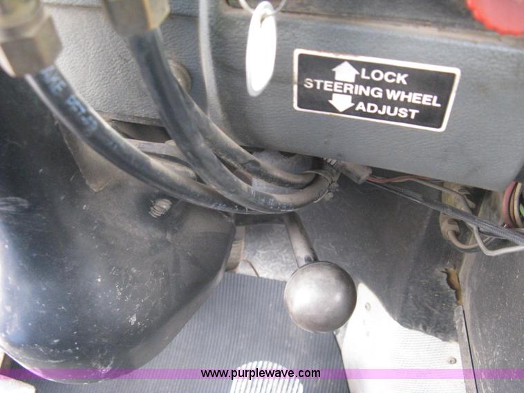 image for item A6153 1989 Mack R688ST tandem axle roll off truck