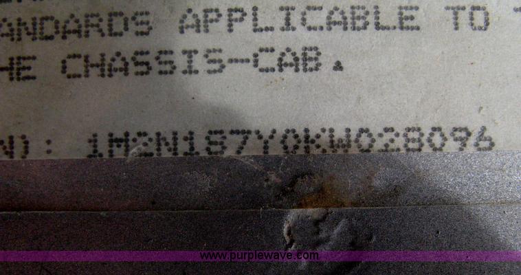 image for item A6153 1989 Mack R688ST tandem axle roll off truck